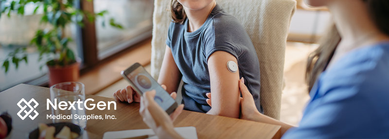 Mom holding daughter's arm that has a continuous glucose monitor on it and her phone with the tracking app in the other hand