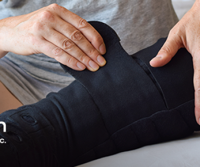 Prescribing Home Pneumatic Compression Person putting on a lymphedema compression sleeve on their leg.